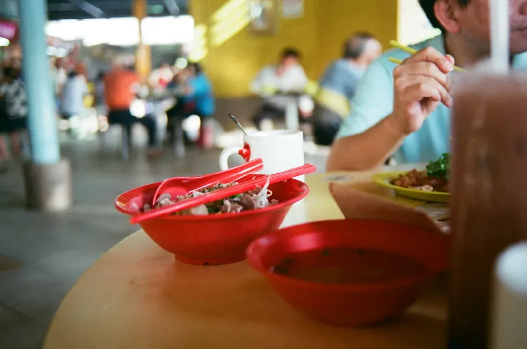 various dishes on display at a bustling Singapore hawker centre